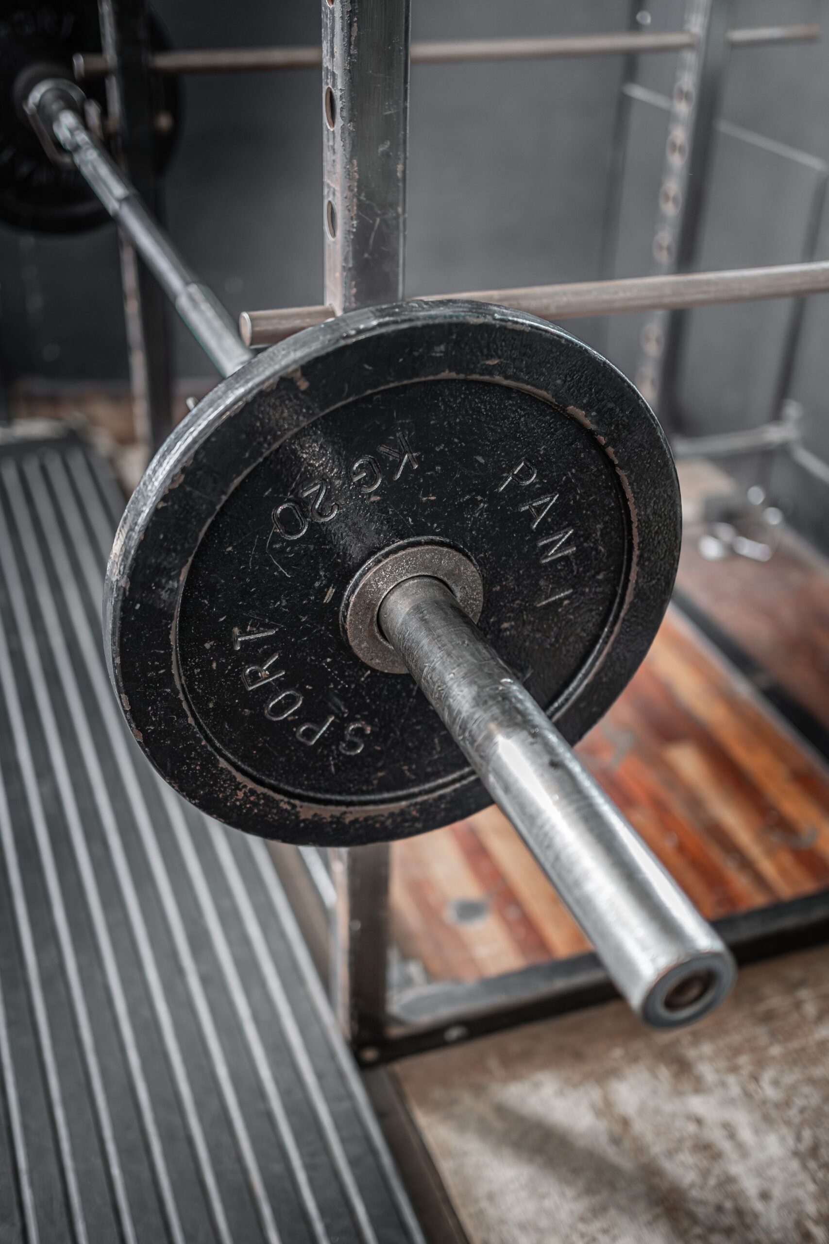 Barbell racked on a home gym power rack