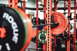Barbell loaded with weight plates on a power rack